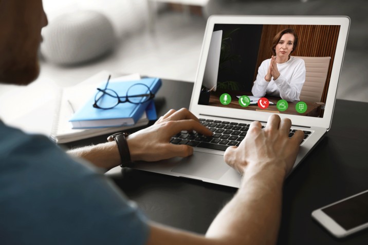 A patient in California speaking with a Beacon or Kaiser online psychiatrist via video call