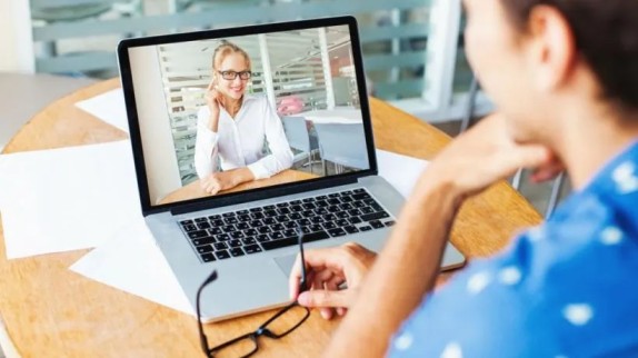 A patient in California having a same day online psychiatry session via laptop.