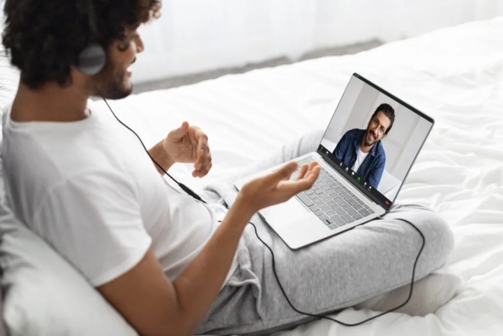 Patient in California receiving telepsychiatry treatment for psychosis on a laptop