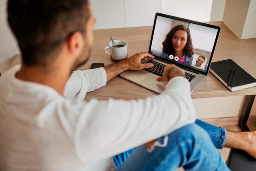 Huntington Beach resident having an online psychiatry session on a laptop
