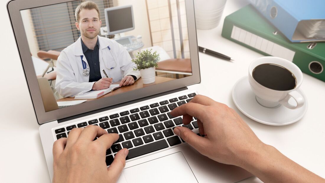 Patient in California receiving online psychiatric care on a laptop