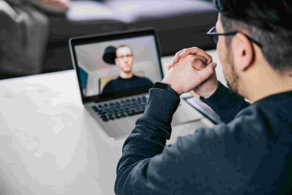 Professional in Los Angeles attending an online session with a psychiatrist to manage work stress