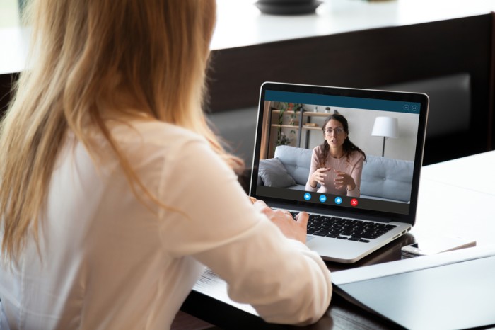 California patient meeting with a virtual panic attack psychiatrist on a laptop