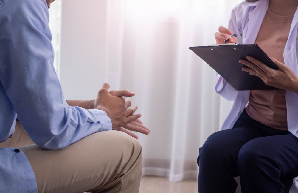 Patient discussing insurance coverage for ketamine therapy with psychiatrist in Sacramento