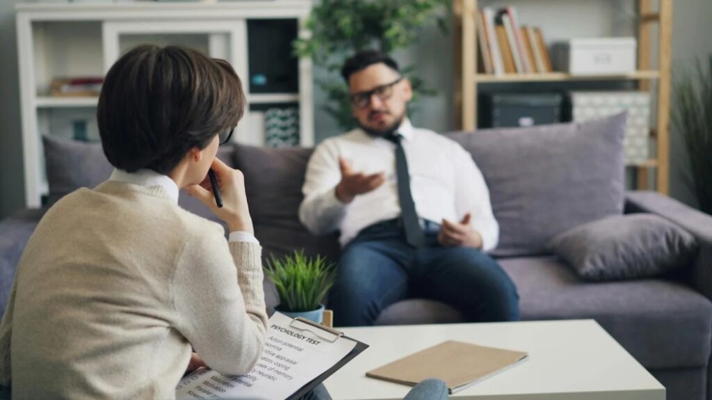 Patient discussing affordable psychiatric care and mental health treatment options with a healthcare professional